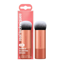 Bubble blending makeup brush with white bristles and rose-gold handle.