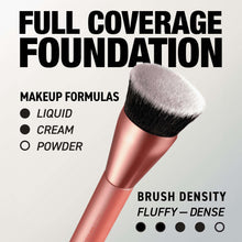 Round foundation brush with fluffy black and white bristles on rose-gold handle