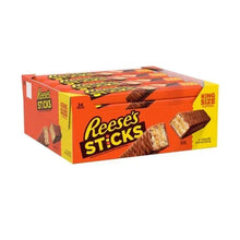 King size candy stick box, orange carton with branded sticks and peanut butter pieces
