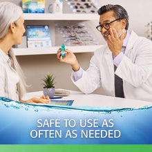Doctor holding teal eye drop bottle near patient