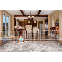 White 8-panel baby gate play yard with tall vertical bars and center gate door