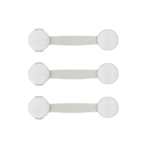 Three white child safety latch straps with round covers, shown in a set