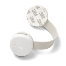 White child safety latch with branded round cover and gray locking strap