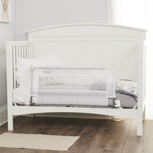 Regalo swing-down crib rail on crib with mesh panel and metal brackets