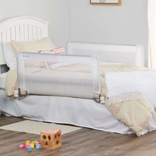 Swing-down bed rail guard on toddler bed with mesh panel and secured bases