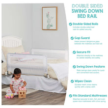 Swing-down bed rail guard on bed with secured corner straps and mesh panel