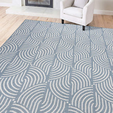Blue area rug with white swirl pattern, corner visible under a chair
