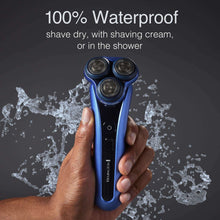 Blue waterproof cordless electric shaver with three foil heads, water droplets around