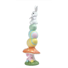 Resin stacked door greeter bunny standing on grass base with pastel spring layers