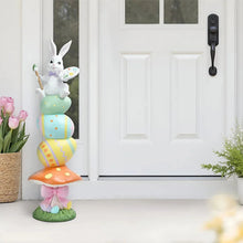 Resin stacked door greeter bunny with palette, on grass base; pastel spring layers