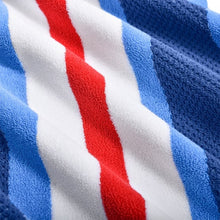 Close-up of red and white vertical stripes on blue towel