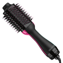 Revlon volumizing hair dryer brush with black barrel and pink accent grip