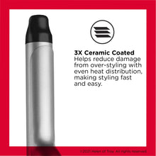 Triple ceramic curling iron in black and silver with clamp area and cord.
