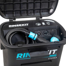 Portable shower unit with open lid, control knobs and coiled hose inside