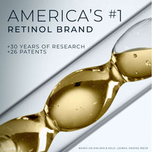 Golden retinol serum drop on a slender applicator tip