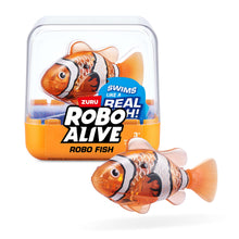 Orange robotic fish with patterned body, shown in clear storage case