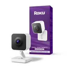 Outdoor security camera on white desk stand with dark lens housing