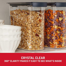 Clear cereal pantry container set with dark gray lids, filled with cereal and cereal mix
