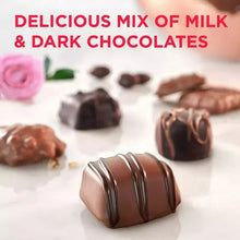 Assorted milk and dark chocolate pieces, including striped and drizzled tops