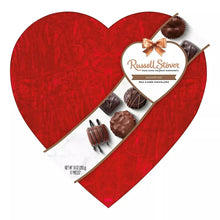 Heart-shaped red chocolate box with Russell Stover label and assorted milk and dark chocolates