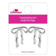 Silver bow earrings with dangling ribbon charms and heart-shaped center