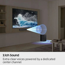 Black soundbar on TV stand in living room