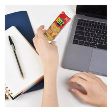Hand holding a Ritz peanut butter cracker sandwiches package