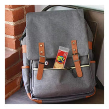Gray backpack with a small Ritz cracker snack tag on the front