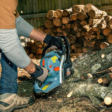 Gas chainsaw used to cut wood log, 18" bar and chain with orange handle controls