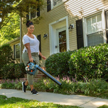Handheld gas leaf blower with angled tube and top carry handle