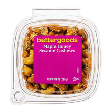 Maple honey sesame cashews in clear plastic container with maroon label