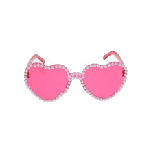 Pink heart-shaped novelty glasses with rhinestone trim and heart lenses