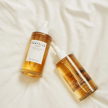 Amber serum bottle and smaller bottle with white dropper caps