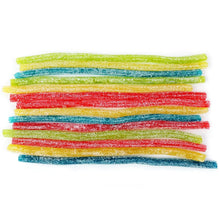 Stack of rainbow colored chewy candy straws