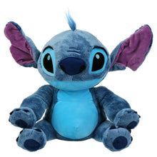 Blue plush alien character with purple ears, big embroidered eyes, and a stitched nose.