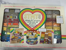 Rainbow jewelry making kit box with bead storage trays and STMT logo