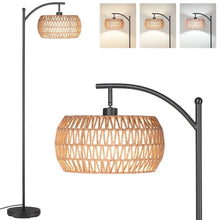 Black arc floor lamp with woven rattan drum shade