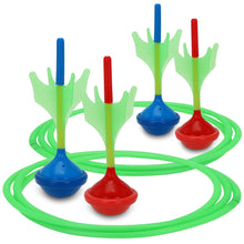 Lawn dart ring targets with four standing darts in blue, red, and green.