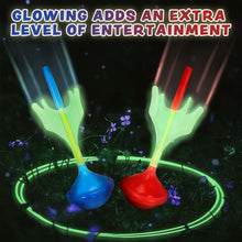 Glowing lawn dart ring targets with blue and red darts and green light border.