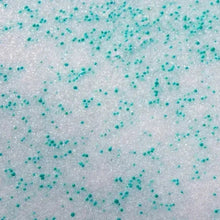 Ice melt granules, white base with small teal particles
