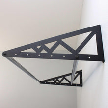 Wall-mounted tire rack assembly with perforated triangular supports on black steel frame