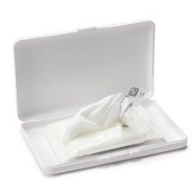 White open storage case holding wipes pack and small grooming items.