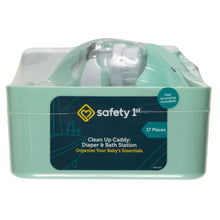 Seafoam plastic cleanup caddy with handle, holding baby grooming items inside.
