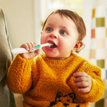 Safety 1st baby grooming toothbrush with white handle and red tip