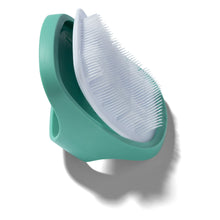 Aqua cradle cap brush head with soft white bristles in raised position