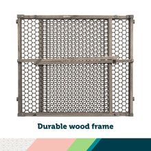 Grey wooden doorway safety gate with full circular mesh panel design and horizontal latch