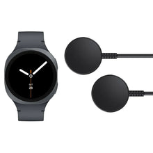Smartwatch with dark screen and gray band, with two round wireless fast chargers