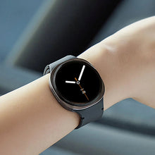 Smartwatch with dark display on wrist with gray silicone band