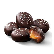 Sea salt caramel chocolate eggs with white sprinkles and one broken egg