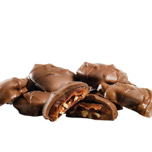 Milk chocolate pecan caramel clusters with caramel filling, assorted pieces